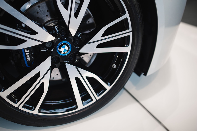 sports car, wheel, land Vehicle, focus on foreground, metal, Silver, shape, indoors, vehicle part, car, transportation, design, bmw, black Color, equipment