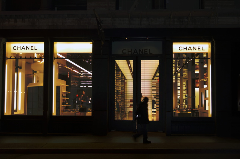 lighthouse, leisure activity, store, standing, chanel, western script, walking, real people, built structure, communication, adult, illuminated, night