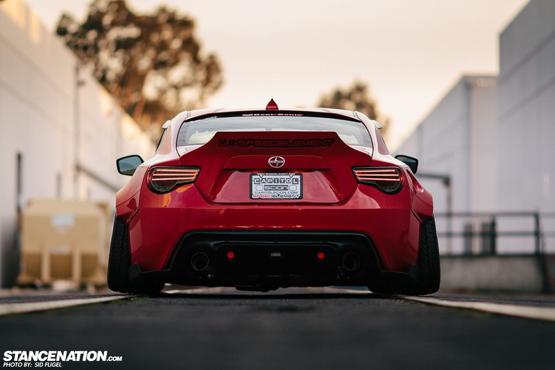 road, transportation, selective focus, tool, built structure, toy, motor vehicle, no people, racecar, day, nature, StanceNation, power, Scion, city, car