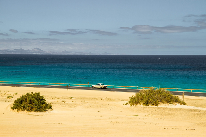 tranquil scene, outdoors, beach, non-urban scene, day, dom, tranquility, island, sand, idyllic, car, turquoise colored, spain, sea, scenics - nature, horizon