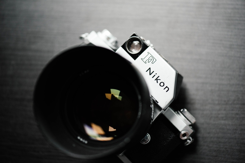 directly above, camera, text, photography themes, dslr, nikon, photography, control, gray, technology, focus on foreground, f, single object, western script