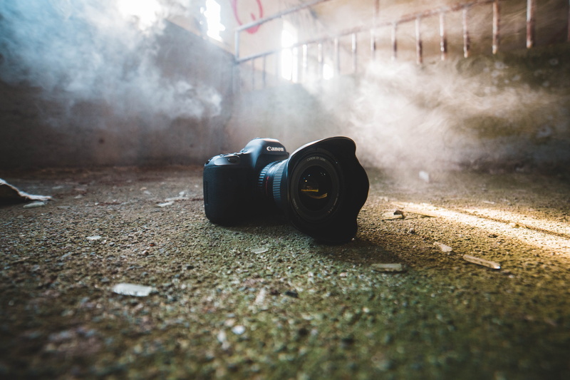 video camera, outdoors, canon, old, slr camera, single object, ground, photography themes, coil, no people, spiral, window, portrait, photographing, camera