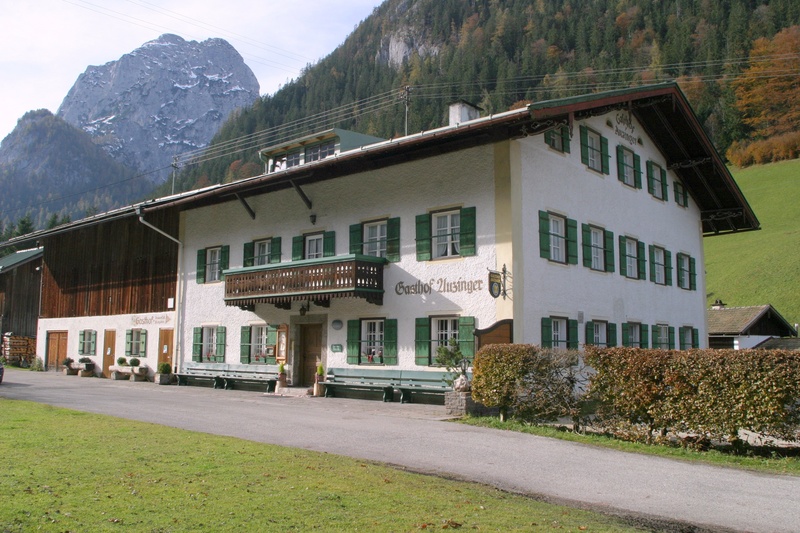 historic guest house, bavarian meals, transportation, built structure, green color, architecture, building, tree, mountain range, house, lawn, road, cottage