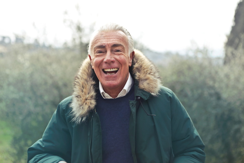 warm clothing, one person, laughing, faux, posing, 60-70 years, adult, senior, green faux fur hooded jacket, mature, winter, man, tree, real people, day