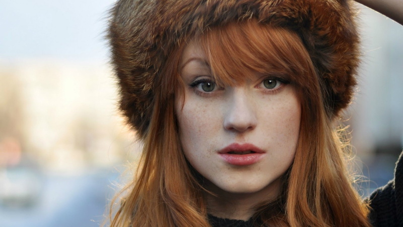 portrait, serious, body part, front view, long hair, headshot, brown hair, human face, adult, focus on foreground, contemplation, women redhead freckles fluffy hat