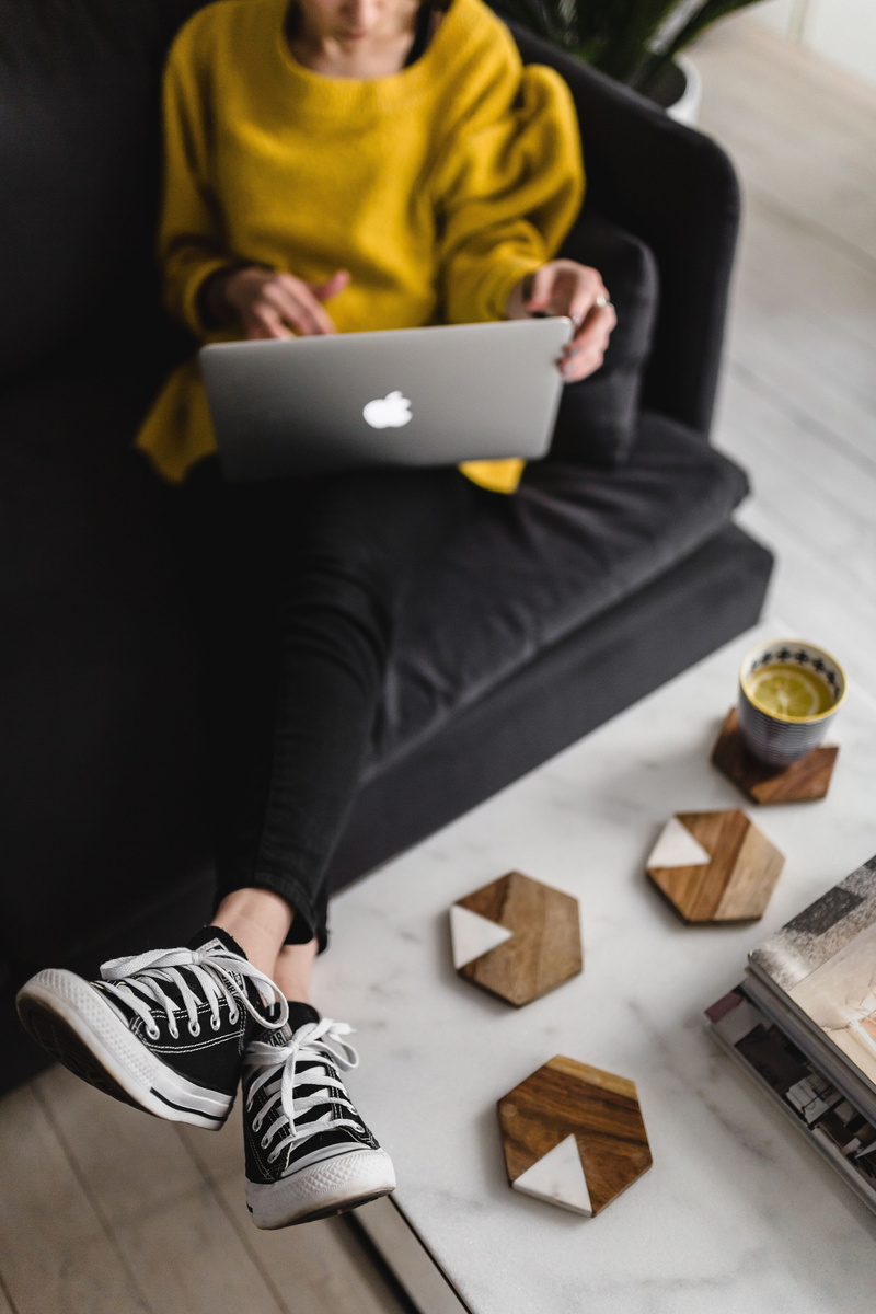 minimalism, front view, scandi, coffee table, sofa, wooden floor, marble table, caucasian Ethnicity, indoors, businesswoman, holding, working, lifestyles