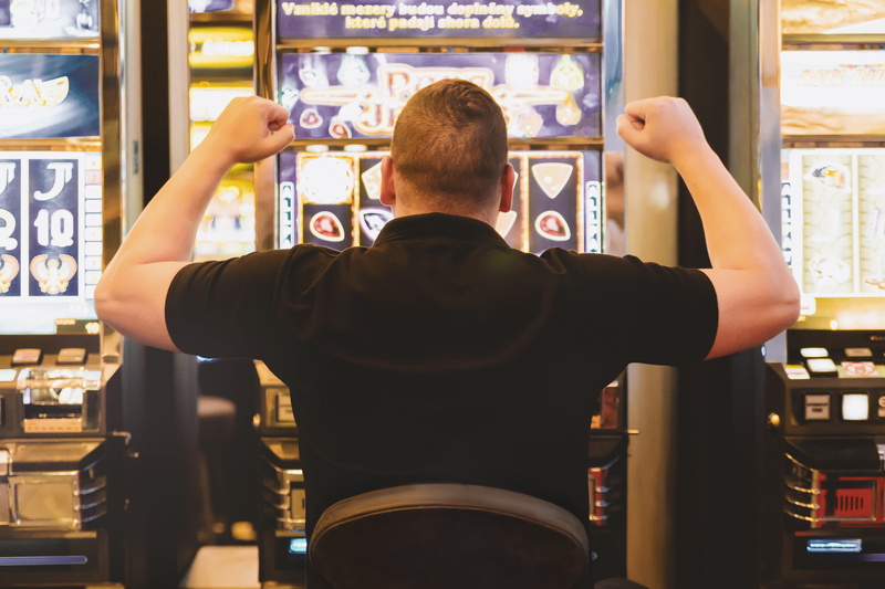 arms raised, standing, man, alcohol, food and drink, human arm, rear view, bar - drink establishment, one person, store, men, indoors, adult, holding, limb
