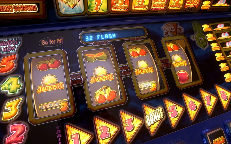 multi colored, communication, technology, in a row, machinery, no people, casino, full frame, western script, illuminated, indoors, arts culture and entertainment