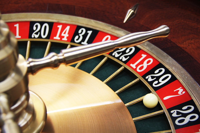 game bank, economy, studio shot, leisure activity, sport, time, wood - material, accuracy, finance, brown, arts culture and entertainment, casino, risk