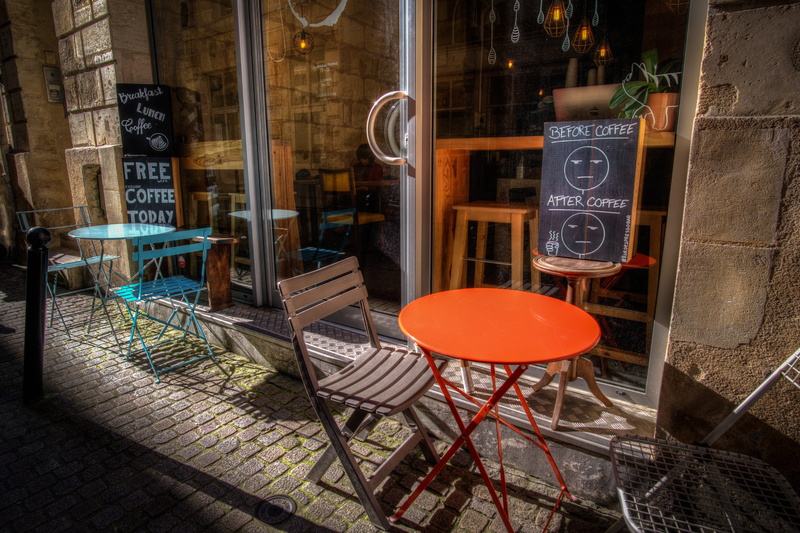 food, building exterior, cafe, western script, table, coffee, caffeine, business, orange color, sign, building, day, architecture, cappuccino, window, coffe