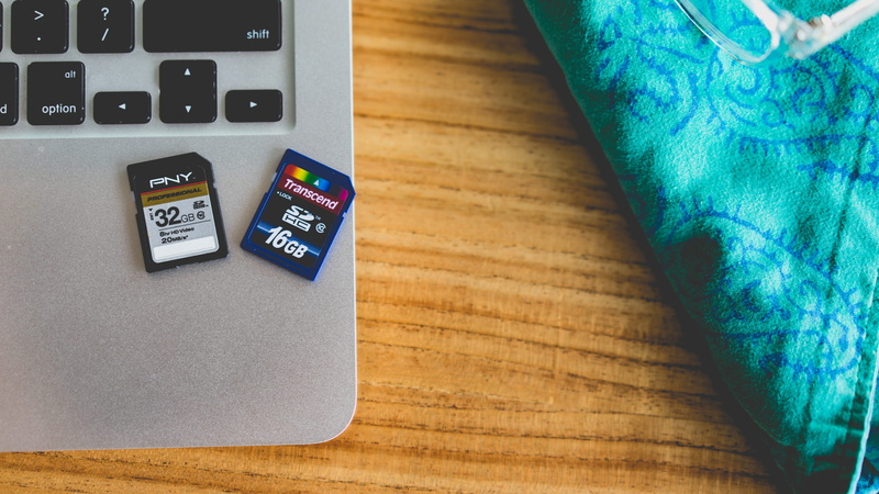 business, 5K, wireless technology, sd card, office, finance, portable information device, wood - material, still life, number, directly above, indoors