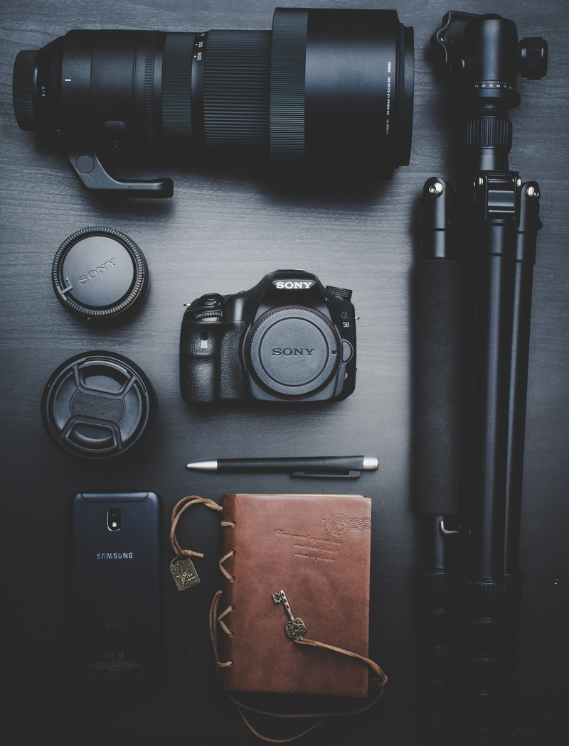 technology, equipment, digital camera, high angle view, table, wireless technology, business, smartphone, close-up, flatlay, lens, photographic equipment