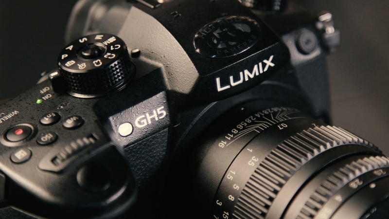 camera - photographic equipment, slr camera, black color, digital camera, business, extreme close-up, black, indoors, high angle view, number, lens, equipment