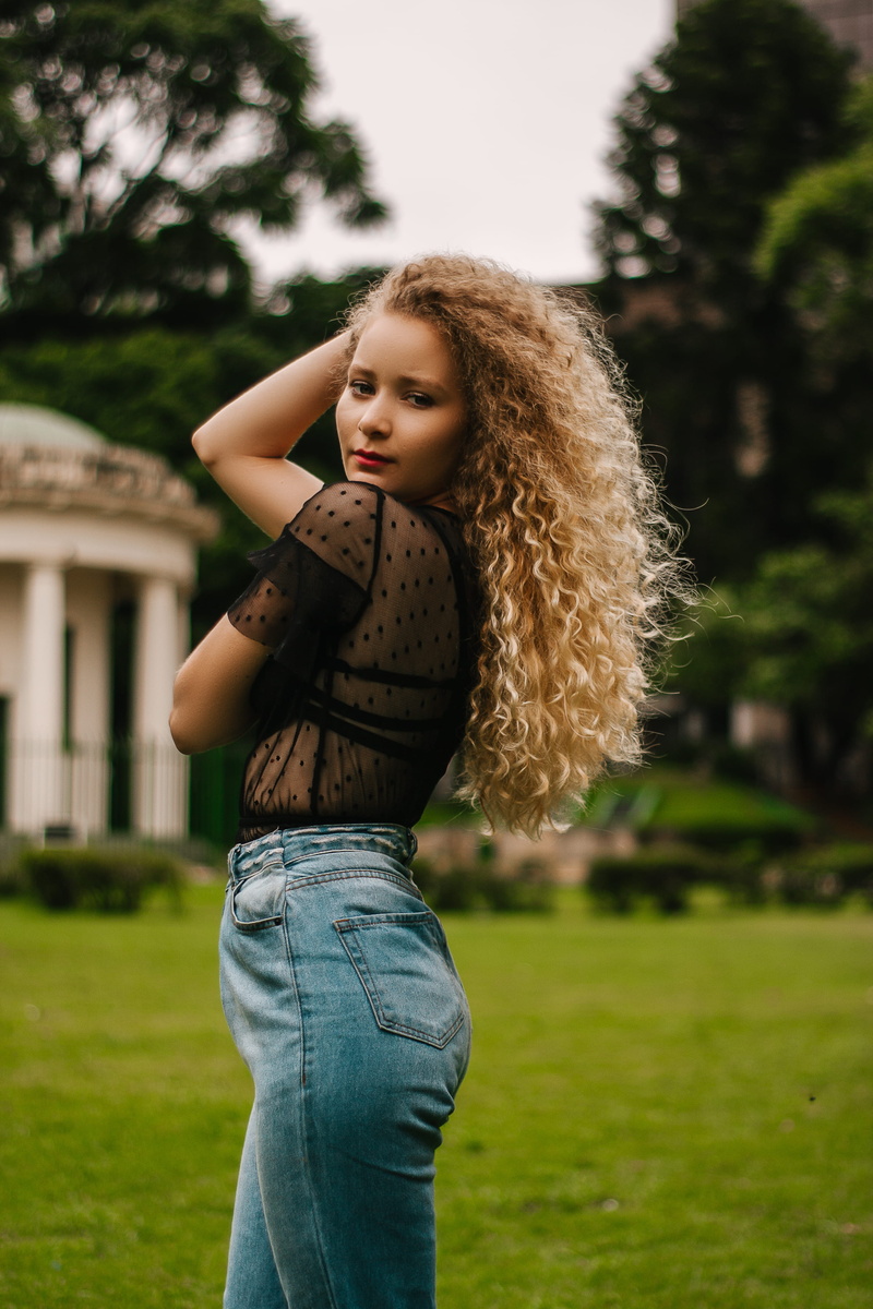 focus on foreground, hairstyle, young women, plant, blue, one person, casual clothing, blonde, top, field, denim, photo, women, photoshoot, hair, lifestyles