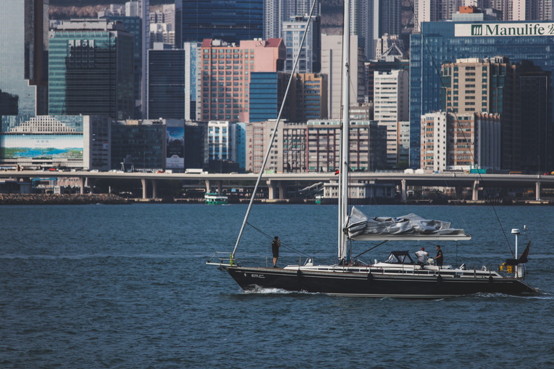 blue, solo, sailing, boat, architecture, outdoors, cityscape, hong kong, nature, building exterior, office building exterior, hong kong island, nautical vessel