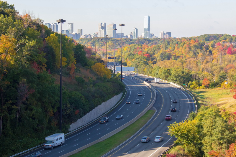 road, nature, direction, high angle view, building exterior, city, dividing line, tree, architecture, symbol, built structure, road marking, street, autumn
