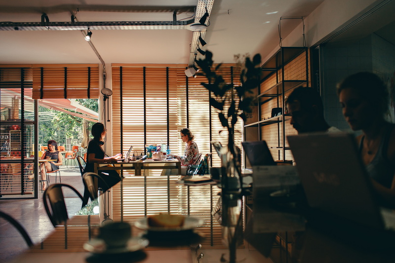 coworking, selective focus, coffee shop, adult, medium group of people, working, wooden, 5K, real people, indoor, women, lifestyles, men, computer, brown