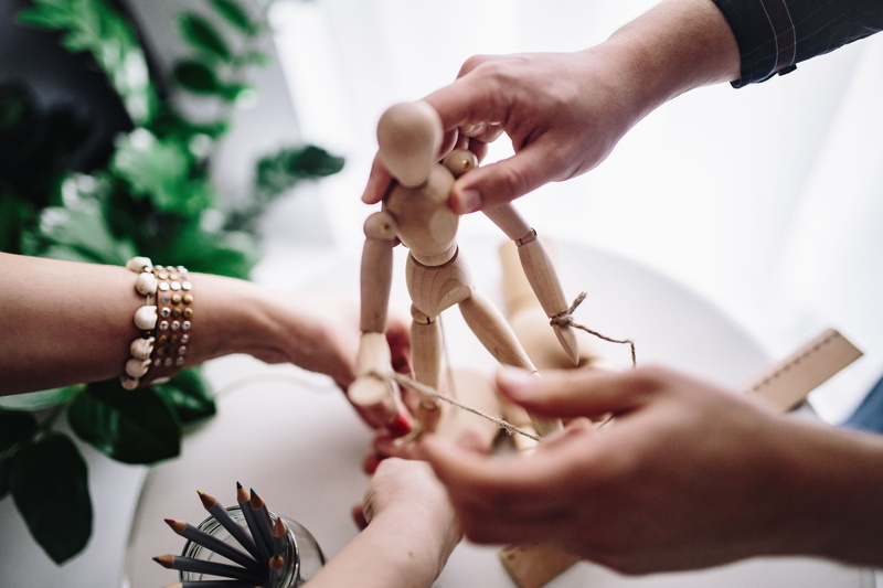 finger, doll, focus on foreground, pencils, men, leisure activity, women, dummy, working, 5K, holding, high angle view, real people, females, human Hand