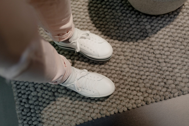 white suede, white shoes, skill, shoes, day, lifestyles, close-up, one person, pink, shoe, leisure activity, leather, white, adult, platform, limb, high angle view