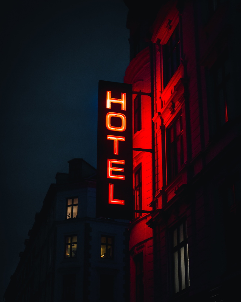 communication, outdoors, commercial sign, building, sky, signage, neon, lighting equipment, sign, city, western script, led, text, building exterior, turned