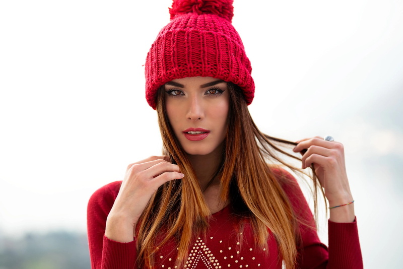 1080P, Wool cap, pink lipstick, bonnet, red sweater, lipstick, model, brown eyes, face, holding hair, women, looking at viewer, sweater, Marco Squassina