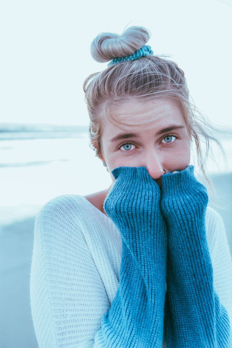 cardigan, covering, women, hair, sweatshirt, blond hair, face, beanie, adult, cap, human, sweater, hat, looking at camera, warm clothing, one person, fleece