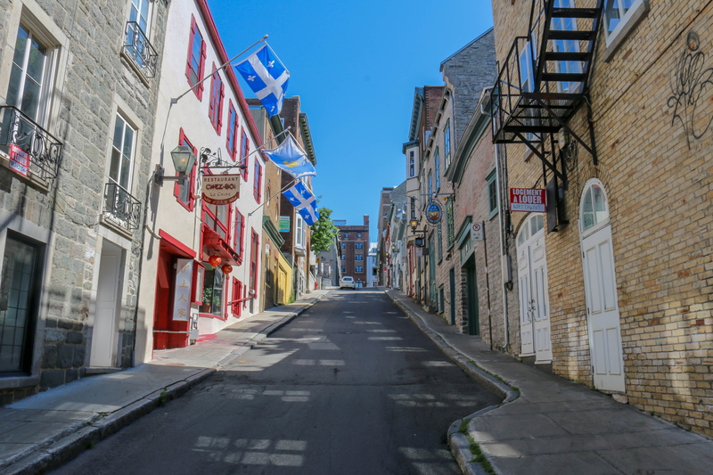 day, building, sky, outdoors, old, quebec, eng, transportation, the way forward, architecture, nature, urban, flag, direction, travel, house, traffic, shield