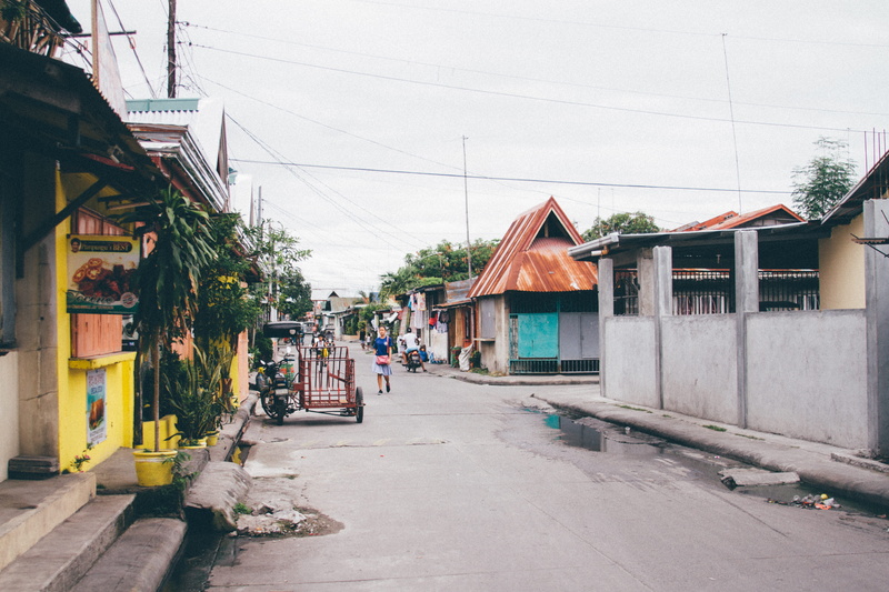 the way forward, street market, residential district, tricycles, city, building, direction, architecture, outdoors, market, road, building exterior, philippines