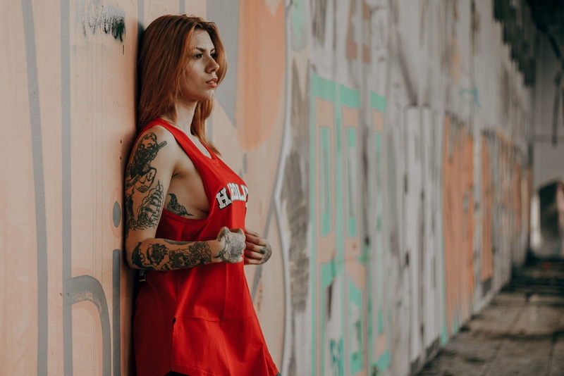 women outdoors, hair, adult, red, standing, side view, T-shirt, looking into the distance, dress, architecture, looking, hairstyle, fashion, model, women