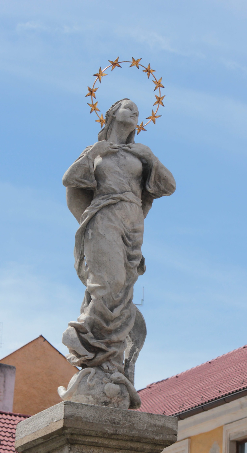building, female likeness, low angle view, architecture, built structure, creativity, building exterior, day, sights, human representation, sculpture, no people