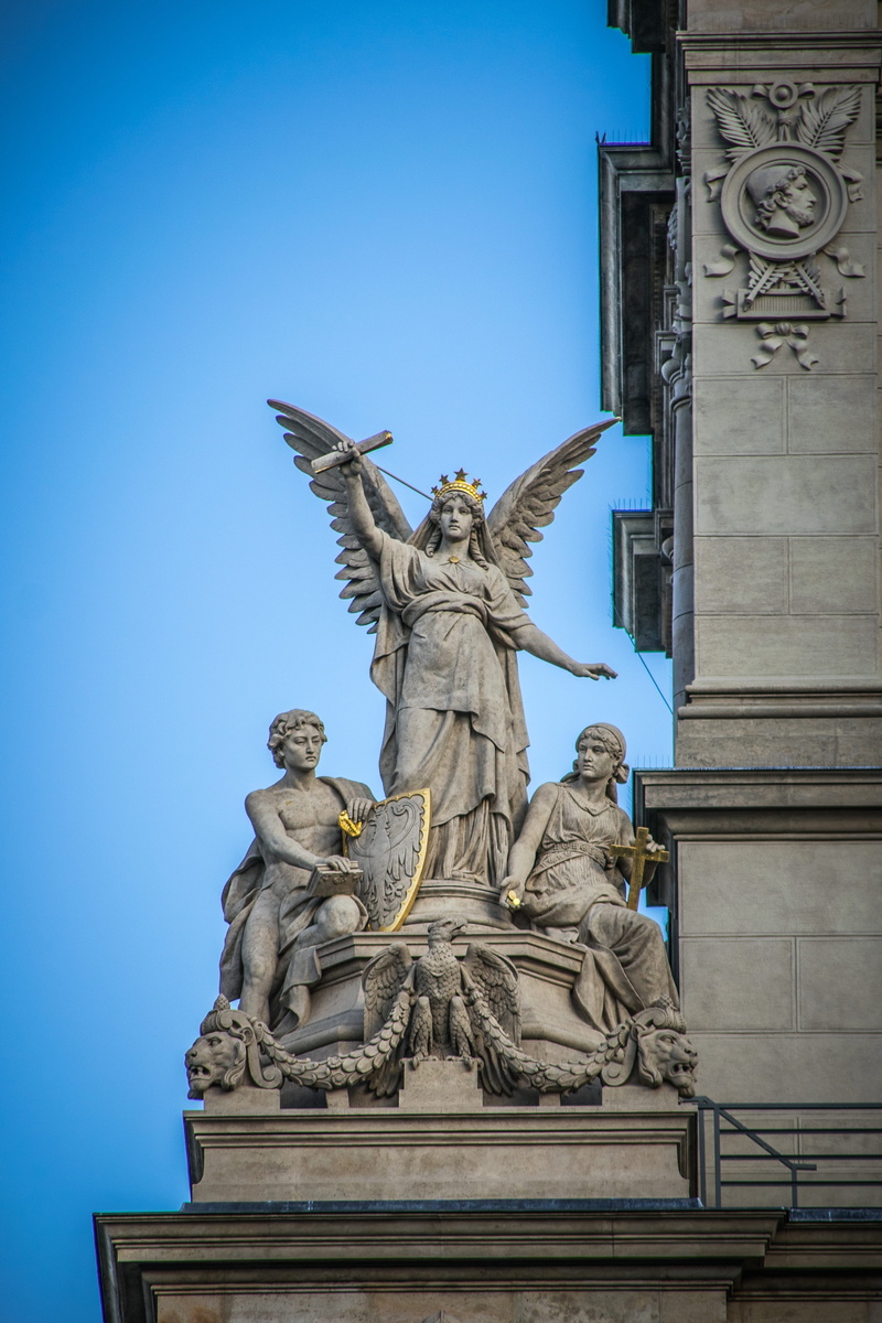 statuary, sculpture, outdoors, built structure, low angle view, art, female likeness, history, building exterior, statue, the past, architecture, art and craft