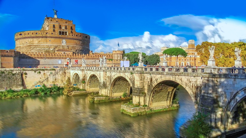castel sant  angelo, connection, arch, sky, outdoors, built structure, buildings, travel destinations, cloud - sky, river, town, old, angelic castle, the past