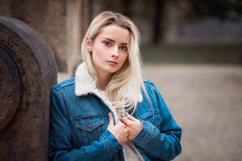 women outdoors, brown eyes, jacket, blonde, Cyril Max, women, 1080P, jeans jacket, looking at viewer, bokeh, face, portrait, depth of field, pearl earrings