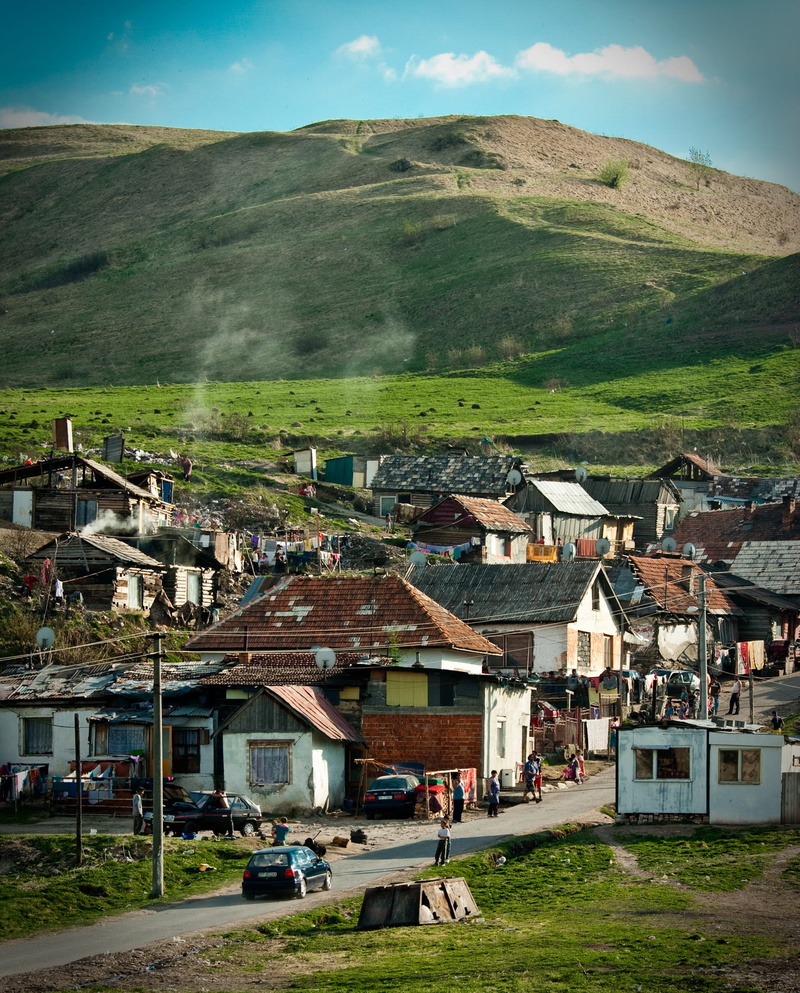 outdoors, land vehicle, plant, land, built structure, mountain, gipsy, grass, building, day, high angle view, landscape, nature, spis, city, outside, ghetto