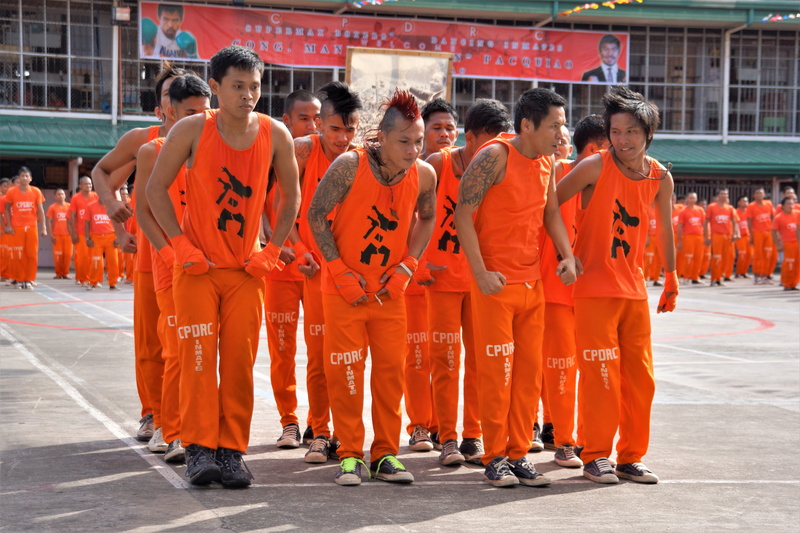 philippines, occupation, show, in a row, architecture, public, teamwork, real people, group of people, day, orange color, prison, filipino prisoners, full length