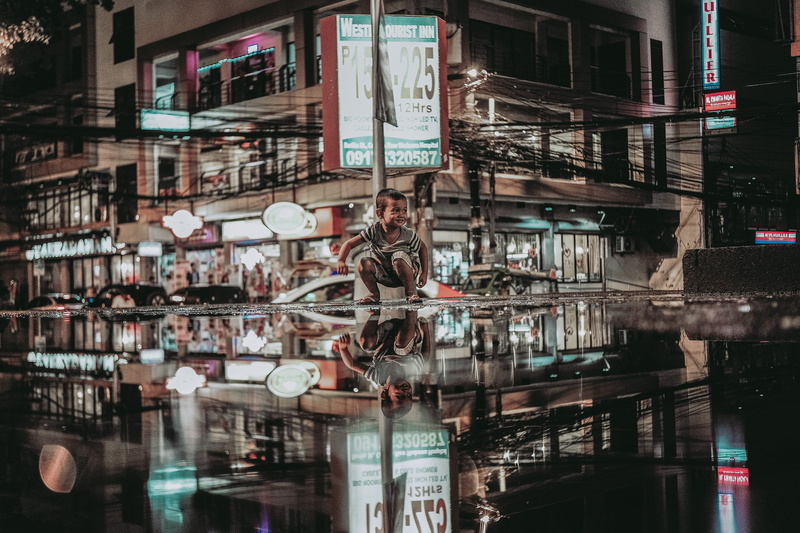 restaurant, photography, built structure, road, puddle, city, urban, building, kid, day, roadside, kid playing, transparent, filipino, photo