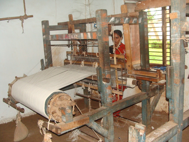 people, equipment, looking at camera, working, spinning, coarse cloth, day, yarn making, adult, metal, garag, thread, flag cloth, machinery, standing, wood - material