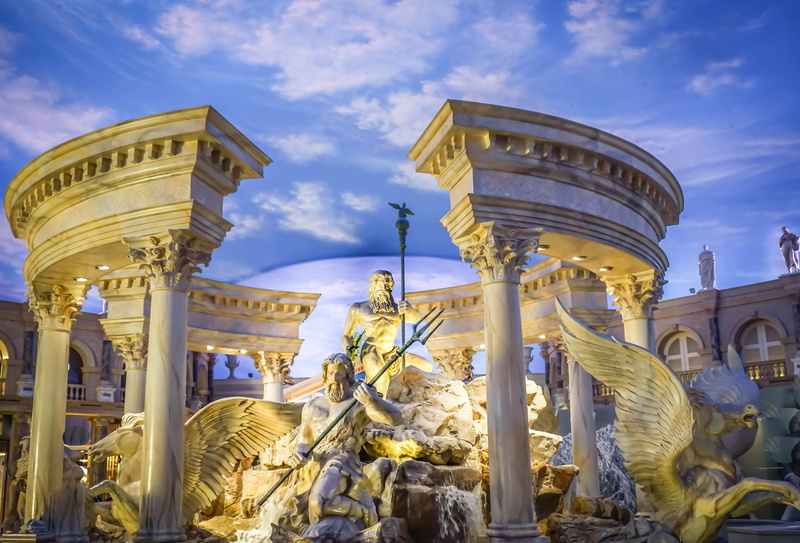 low angle view, the past, daytime, famous, built structure, building exterior, human representation, outdoors, representation, concrete, tourism, strip