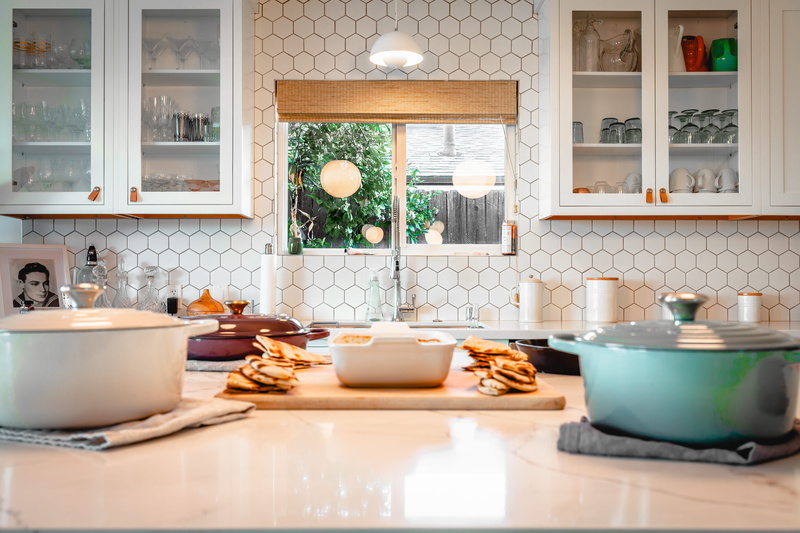 room, flooring, cup, human, kitchen counter, coffee cup, prepare, meal, saucer, architecture, kitchen, home, potted plant, food, dish, kitchen utensil