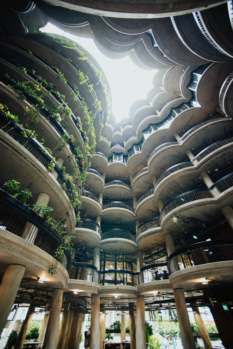 layers, outdoors, architectural column, railing, balcony, plants, brown, repetition, building, day, low angle view, sunlight, in a row, floors, rails, travel