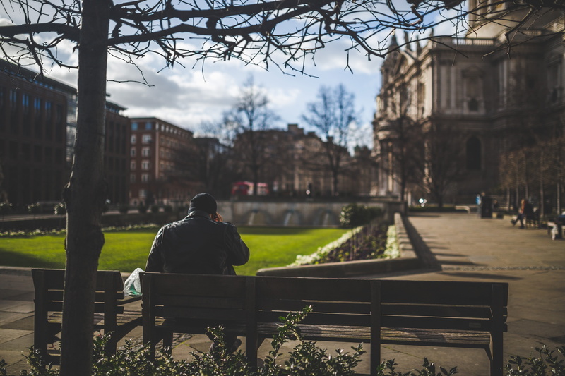 sitting, day, men, building exterior, park, architecture, 5K, leisure activity, park - man made space, plant, umbrella, lifestyles, park bench, seat, real people