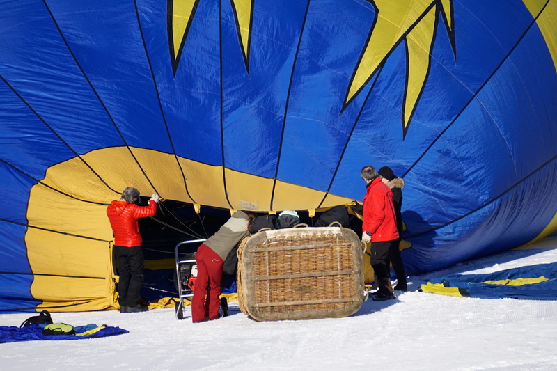 warm clothing, hot air balloon ride, experience, occupation, cold temperature, air, ballooning, transportation, float, snow, leisure activity, blue, lifestyles