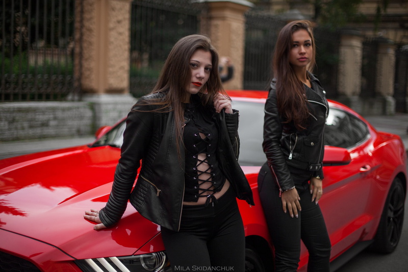 jacket, car, standing, clothing, focus on foreground, three quarter length, red lipstick, women with cars, beautiful woman, women outdoors, leather jacket