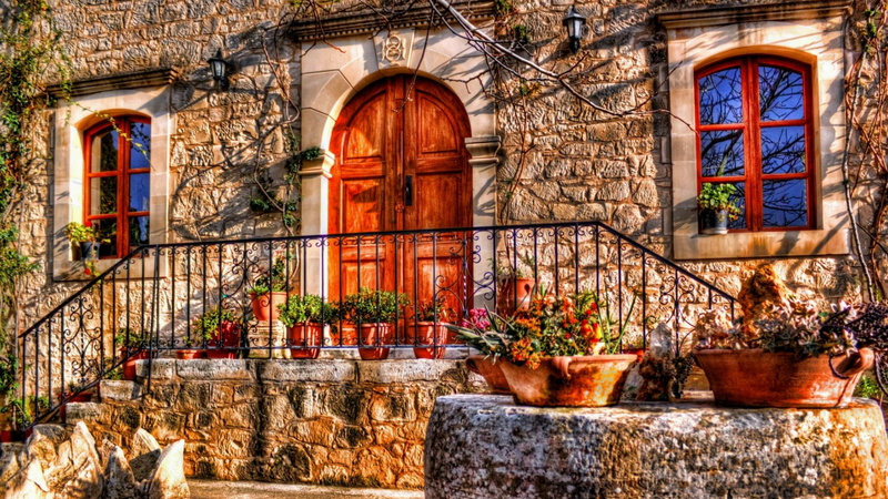 door, window, entrance, home, plant, potted plant, built structure, flower pot, nature, outdoors, building exterior, belief, railing, building, place of worship
