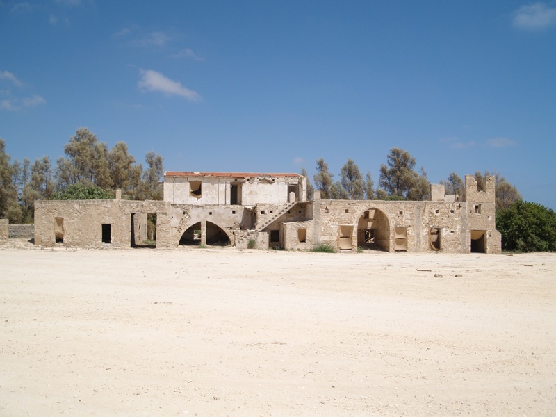 building, day, land, nature, field, tree, building exterior, hacienda, plant, empty, facade, old, copy space, blue, outdoors, stone, sky, architecture