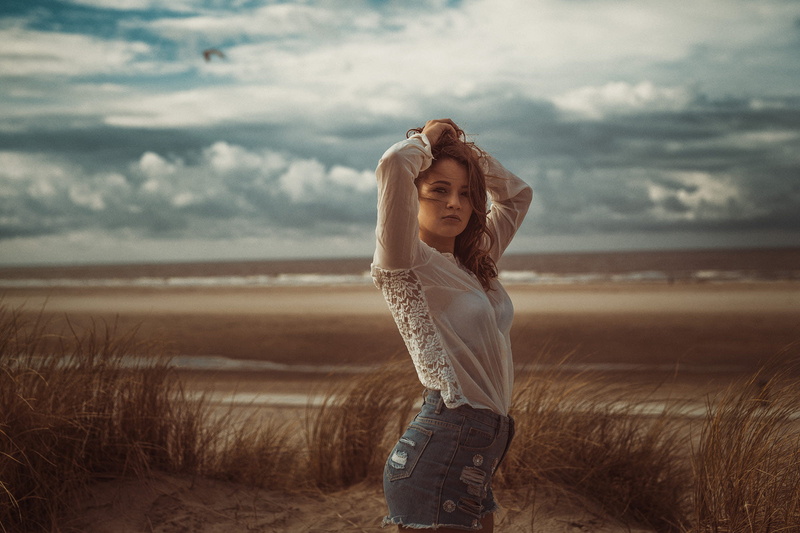 sky, brunette, face, short shorts, standing, women outdoors, jean shorts, high waisted, see-through clothing, Marcel J. Zahlten, 1080P, white shirt, hands in hair