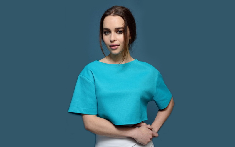 beautiful woman, indoors, women, sadness, irritation, adult, standing, blue background, waist up, studio shot, young adult, front view, t-shirt, emotion