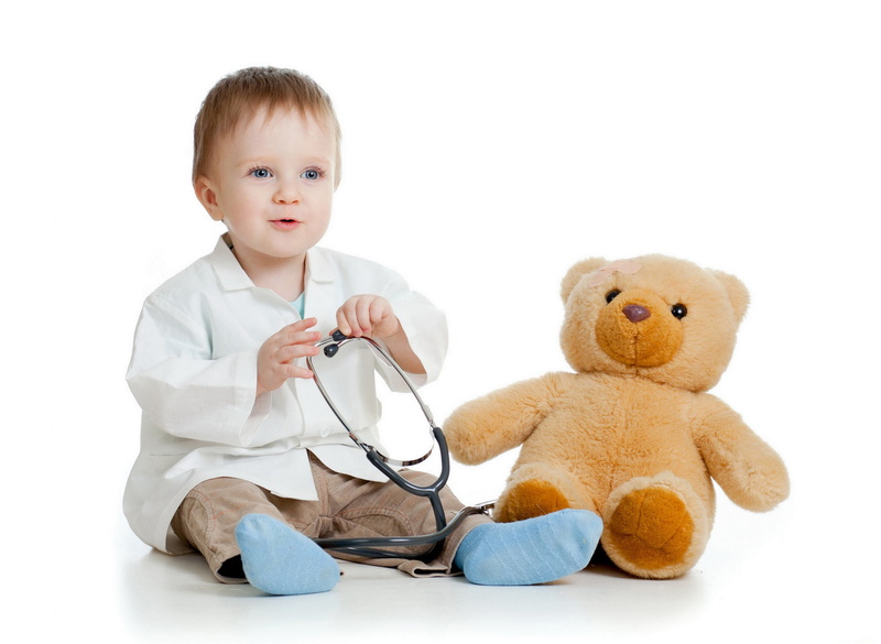 studio shot, medical supplies, indoors, sitting, Bathrobe, stuffed toy, plush, bear, childhood, doctor, front view, holding, innocence, boy, cute, brown