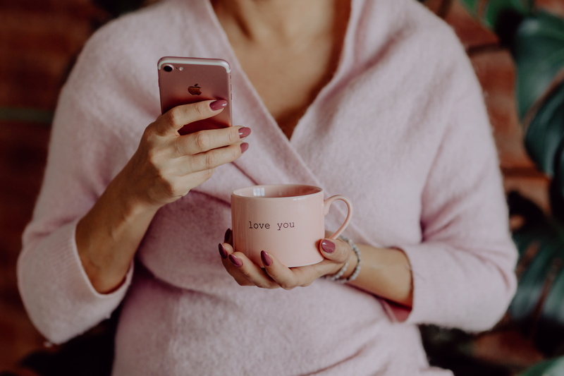 food and drink, portable information device, women, iphone, tech, technology, indoors, apple iphone, love you, smart phone, woman, hot drink, texting, pink cup