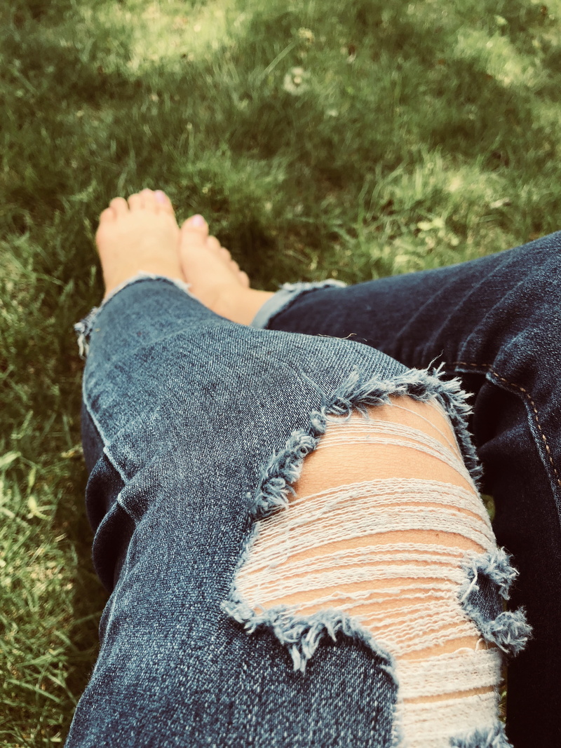 human leg, real people, day, human limb, outdoors, low section, green, denim, body part, human, feet, casual clothing, jeans, one person, human foot, summer
